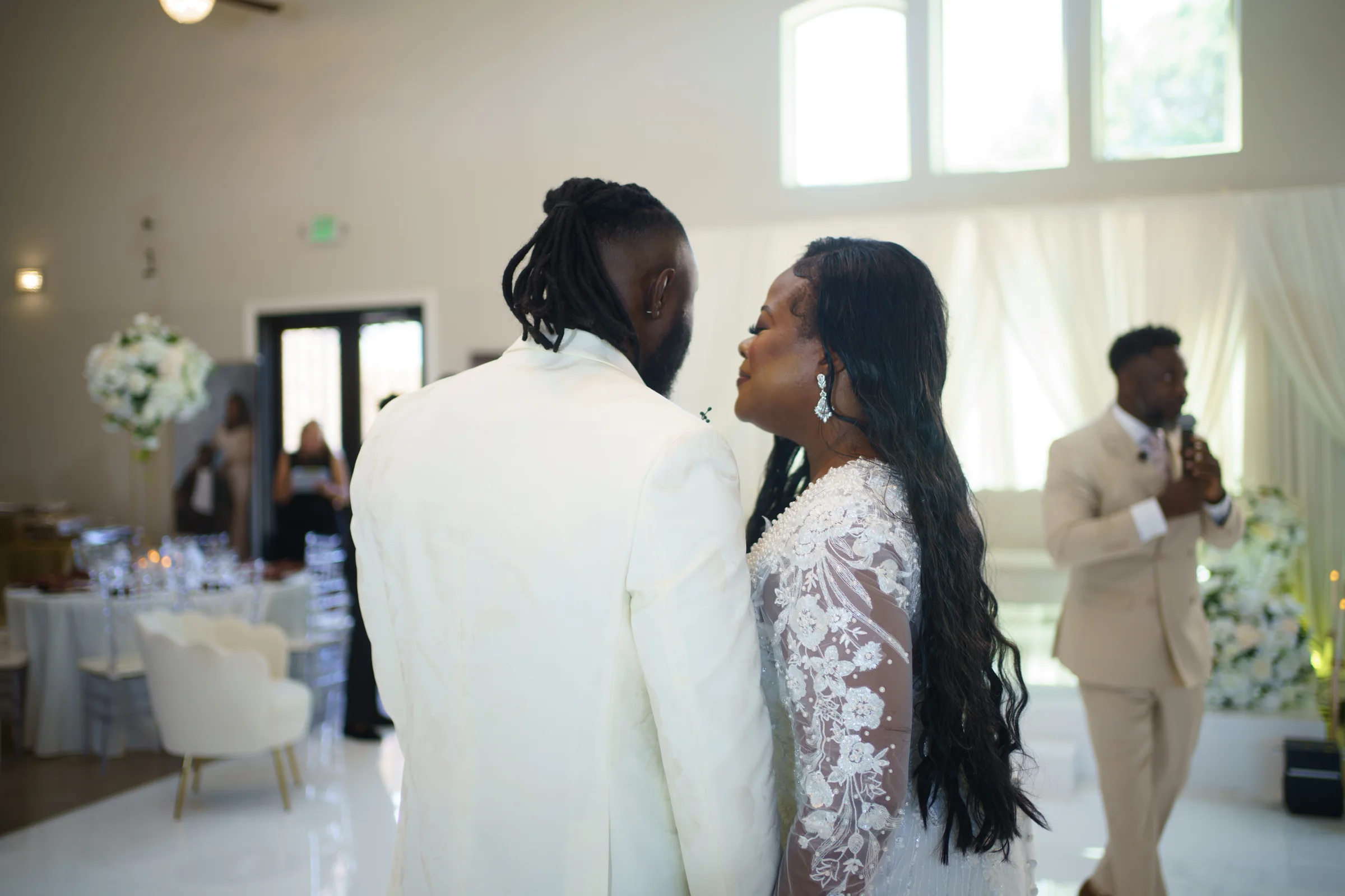 A newlywed couple sharing a quiet moment at their reception